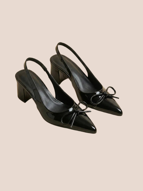 Black Dira Slingback Bow Pumps with glossy patent leather finish, pointed toe design, and adjustable slingback strap, featuring a decorative bow detail at the front, high stiletto heel.
