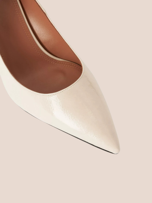 Ivory pointed toe block heels for women with a stylish cream finish.