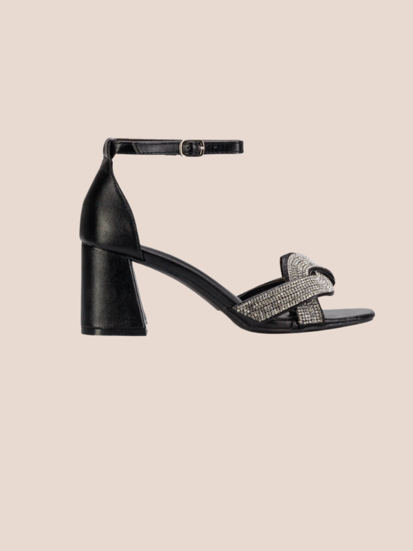 Lustra knot crystal heel sandals in black for women, elegant block heel with sparkling crystal knot strap and ankle buckle for party wear.
