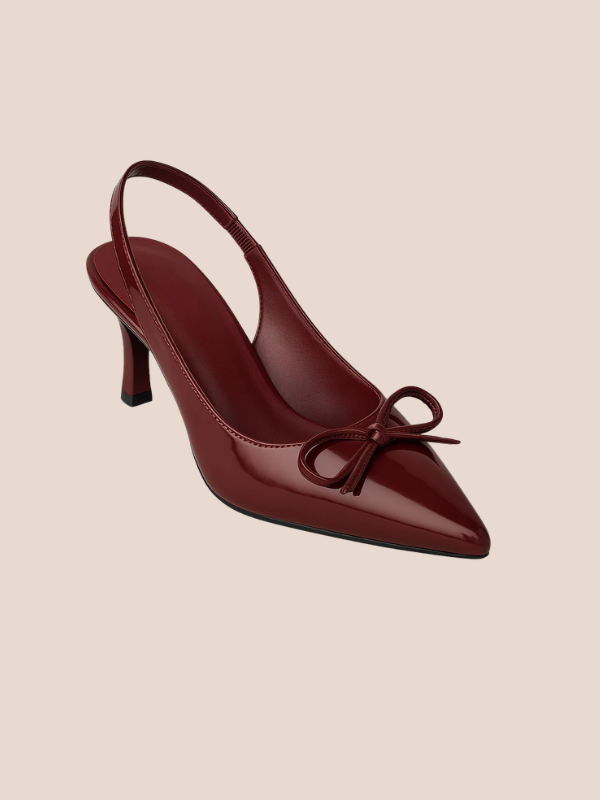 Maroon Dira Slingback Bow Pumps with glossy patent leather finish, pointed toe design, and adjustable slingback strap, featuring a decorative bow detail at the front, high stiletto heel.