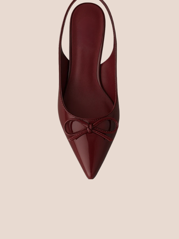 Maroon Dira Slingback Bow Pumps with glossy patent leather finish, pointed toe design, and adjustable slingback strap, featuring a decorative bow detail at the front, high stiletto heel.