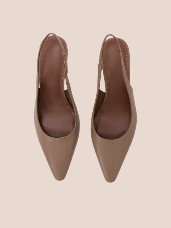Nude brown pointed-toe slingback flats with a sleek slip-on design and open back strap.