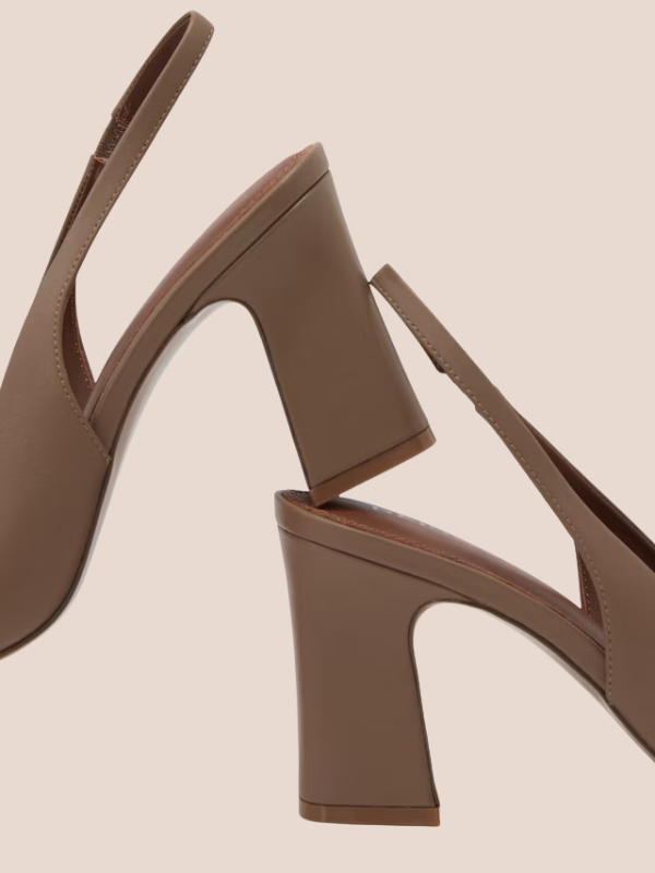 Nude brown pointed-toe slingback flats with a sleek slip-on design and open back strap.