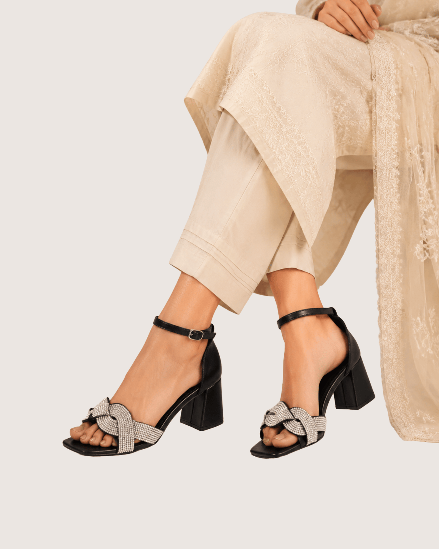 Lustra knot crystal heel sandals for women, luxury block heel with crystal embellished knot strap and ankle closure for formal occasions.